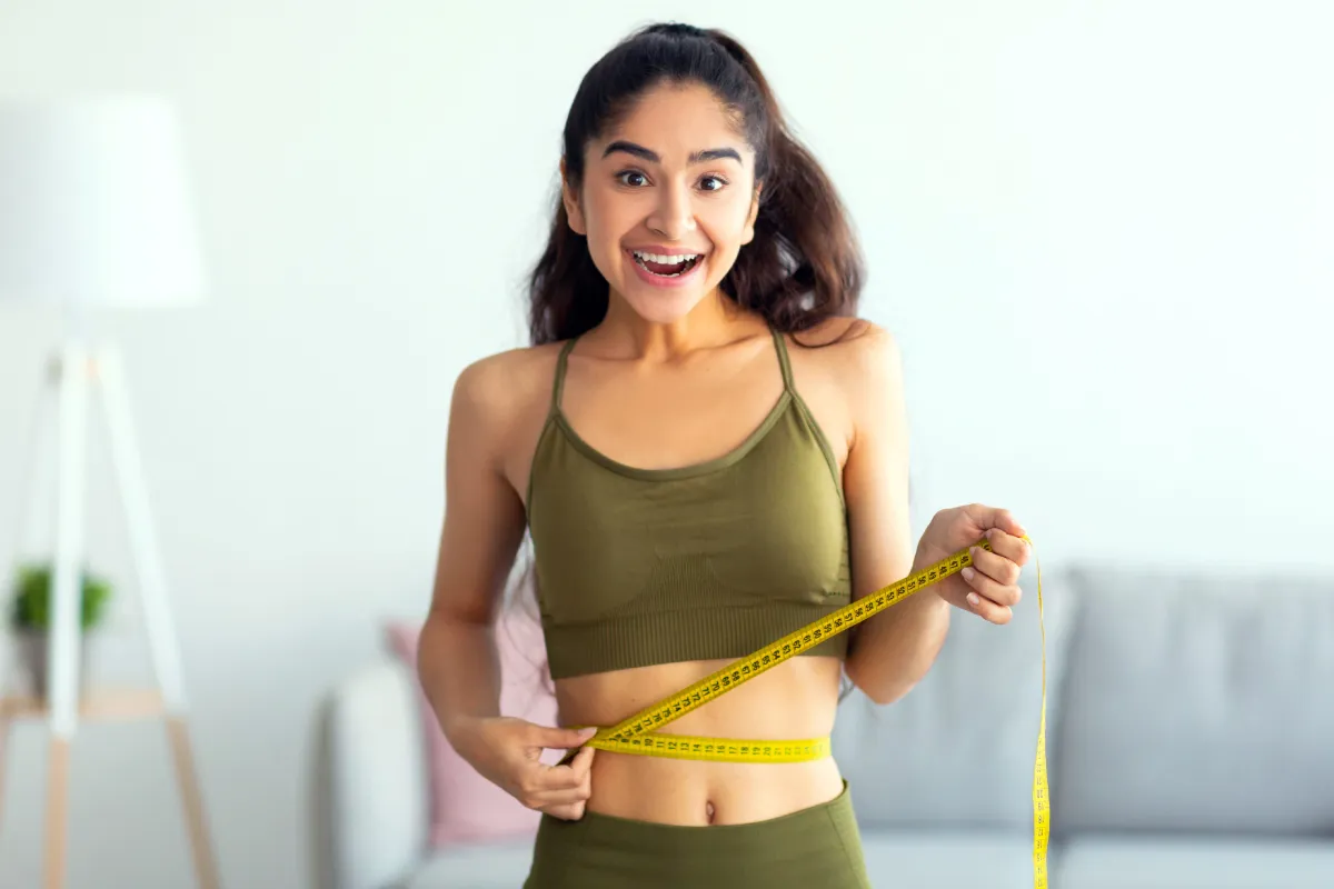 Patient celebrating sustainable weight management success at Skincredible
